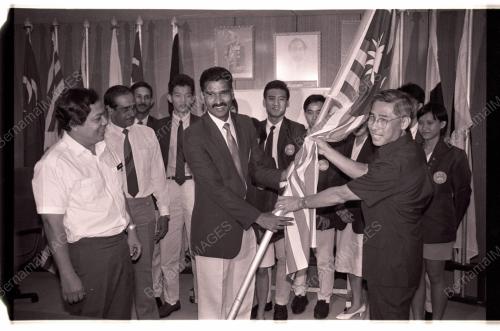 HANDING OVER FLAG TO SQUASH SQUAD TO CALCUTTA