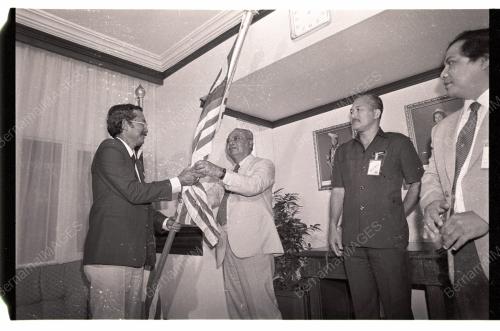 GHAFAR BABA HANDS OVER MALAYSIAN FLAG