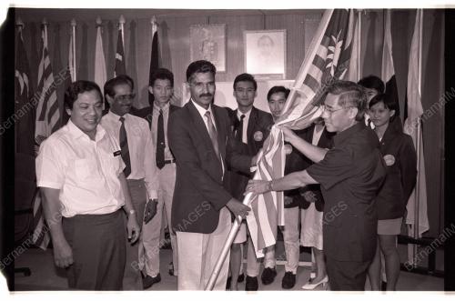 HANDING OVER FLAG TO SQUASH SQUAD TO CALCUTTA