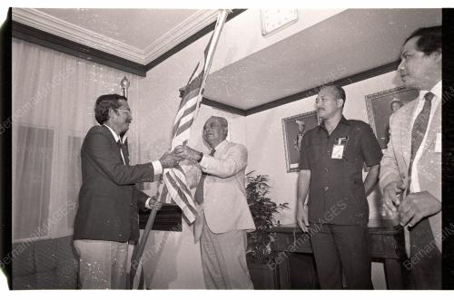 GHAFAR BABA HANDS OVER MALAYSIAN FLAG