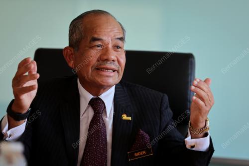 TAN SRI MOHD SIDEK HASSAN