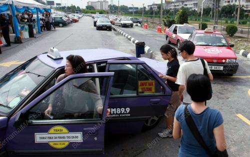 PENUMPANG GUNA TEKSI BERKUPON