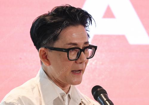 ANDREW TAN