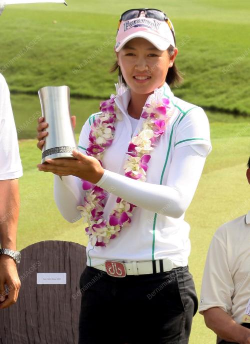 KELLY TAN