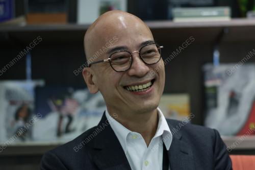 MARK TAN