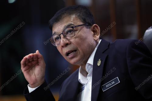 DATUK DR ROSLAN HUSSIN