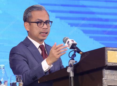 MENTERI KOMUNIKASI FAHMI FADZLI