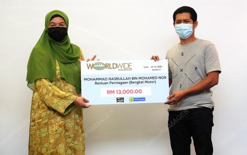 MAJLIS PENYAMPAIAN AGIHAN ZAKAT WORLDWIDE HOLDING BERHAD