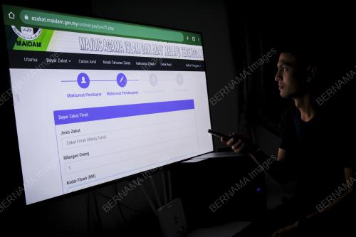 PEMBAYARAN ZAKAT FITRAH SECARA DALAM TALIAN